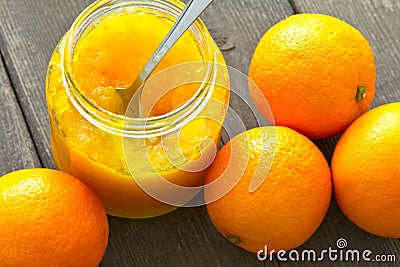 Orange marmalade jar spoon oranges Stock Photo