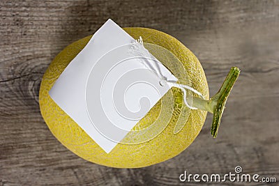 Orange melon on wood table with white lable Stock Photo