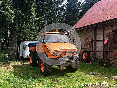 Orange Mercedes-benz Unimog 406 truck at Klinovec, Czech Republic used for mountain rescue service Editorial Stock Photo