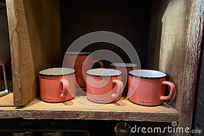 Orange metal cups in a shop Stock Photo