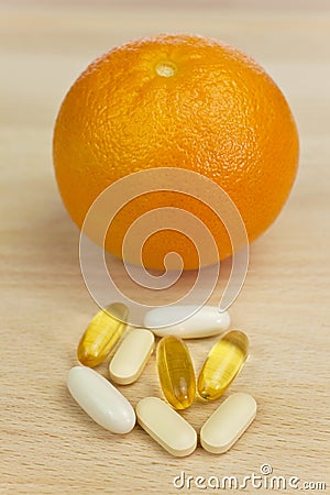 Orange & Nutrition Supplement Tablets or Medicine Stock Photo