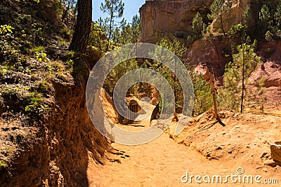 Orange ochre pigment picturesque hills. Languedoc - Roussillon, Stock Photo