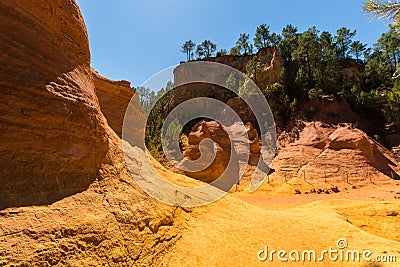 Orange ochre pigment picturesque hills. Languedoc - Roussillon, Stock Photo