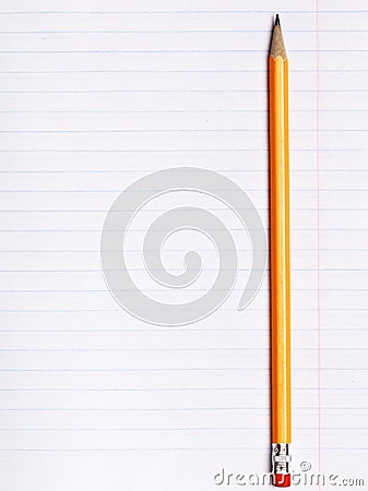 Orange pencil lies on a sheet of paper notebook with lines of inclination. The concept of education Stock Photo