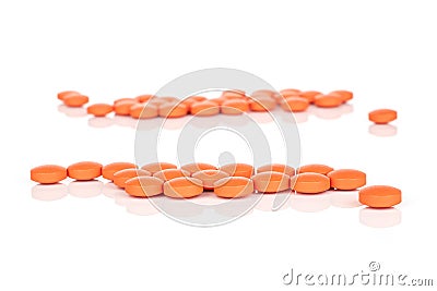 Orange pharmacy tablet isolated on white Stock Photo