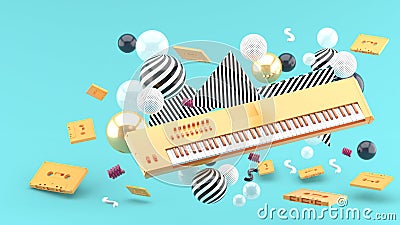 Orange piano keyboard and orange tape amidst colorful balls on a blue background. Stock Photo