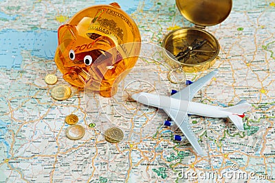 Orange piggy bank with savings money for traveling. Stock Photo