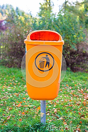 Orange plastic dust bin Stock Photo