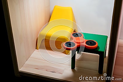 Orange plastic hand spinner Stock Photo