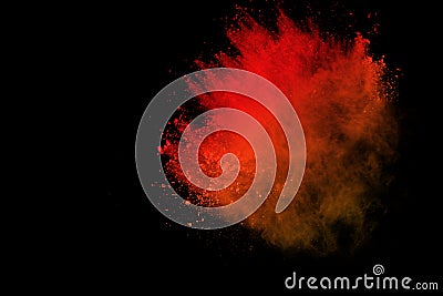 Freeze motion of colored powder explosion isolated on black background. Abstract of Multicolor dust splatted. Stock Photo