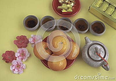 Orange put beside Chinese Tea on background Stock Photo