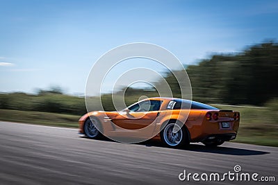 Orange race car chevrolet at the track Editorial Stock Photo