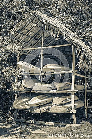 Orange red blue canoes Muyil Lagoon boat trip in Mexico Editorial Stock Photo