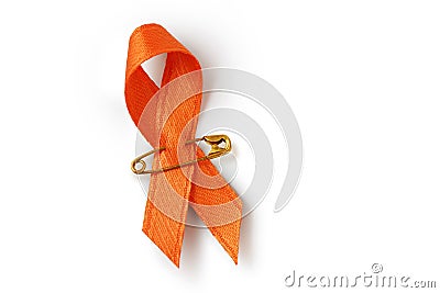 Orange ribbon with safety pin on white background - Concept of leukemia awareness, kidney cancer association, multiple sclerosis Stock Photo