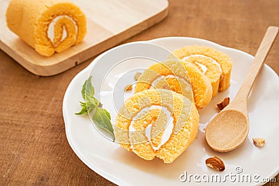 Orange roll cake on plate Stock Photo