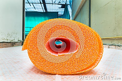 Orange roll of membrane waterproofing, separation and steam escape. Drainage system for floor of terrace - roof Stock Photo