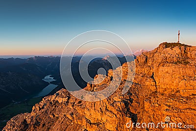 Orange rough rocks of mountain at sunset light Stock Photo