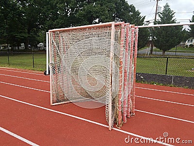 Orange running track with soccer goals Stock Photo