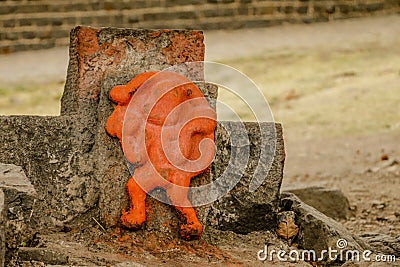 Orange, Saffron Hanuman Statue at a Temple Stock Photo