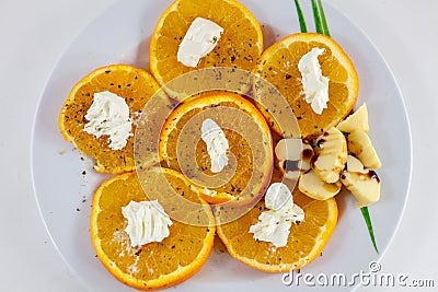 Orange salad and flat cheese from North Africa Stock Photo