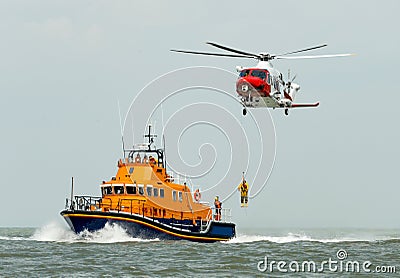 Orange sea rescue boat with rescue helicopter Editorial Stock Photo