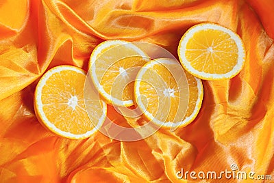 Orange on a silk background. Stock Photo