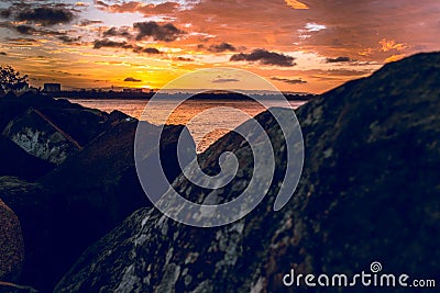 Orange Skies On The Rocks Stock Photo