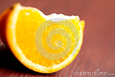 Orange Slice On Table Stock Photo