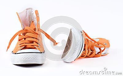 Orange sneakers isolated Stock Photo