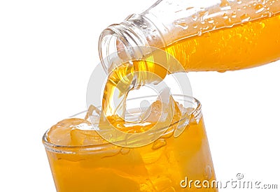 Orange soda pouring into glass Stock Photo