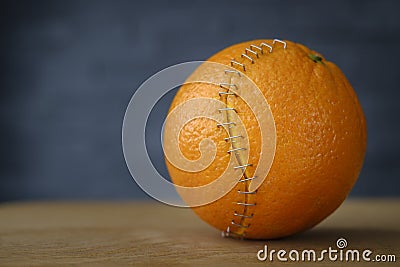 Orange with stainless steel sutures Stock Photo