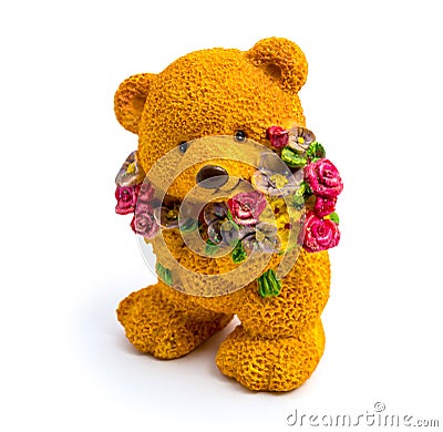 Orange statuette of a bear with flowers isolated on a white background Stock Photo