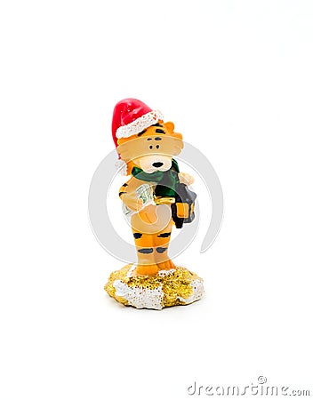 Orange statuette of a tiger with dollars on a white background. Stock Photo