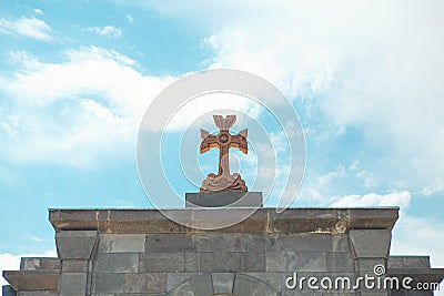 Orange stone cross Stock Photo