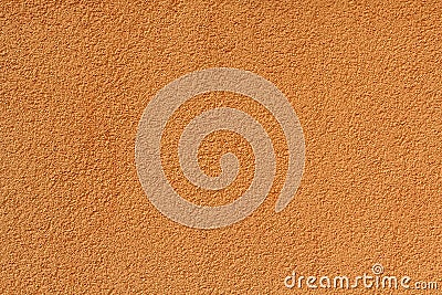 Orange stucco relief on the wall of the house Stock Photo