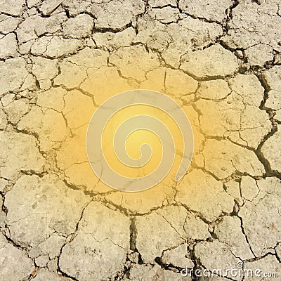 Orange sunbeam on dry ground of cracked clay Stock Photo