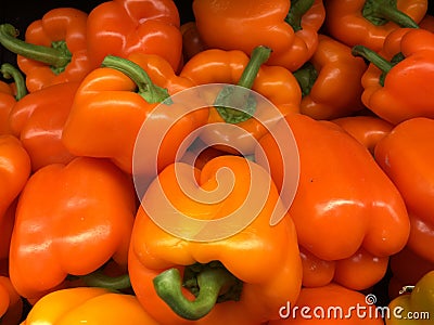 A pile of orange bell peppers Stock Photo