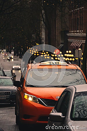 ORANGE TAXI in Gastown, Vancouver Editorial Stock Photo