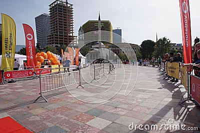 Orange umbrellas and flags in Tirana Marathon Editorial Stock Photo