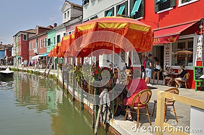 Orange umbrellas in outdoor restaurant Editorial Stock Photo