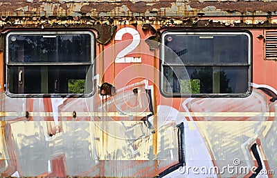 Orange waggon sprayed with graphic characters Stock Photo