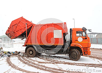 Orange waste collection truck Stock Photo