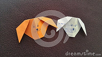 Orange and White dog origami drwan with face Stock Photo