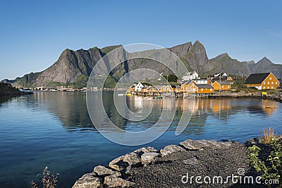 Orange wooden house called rorbu on Lofoten Stock Photo