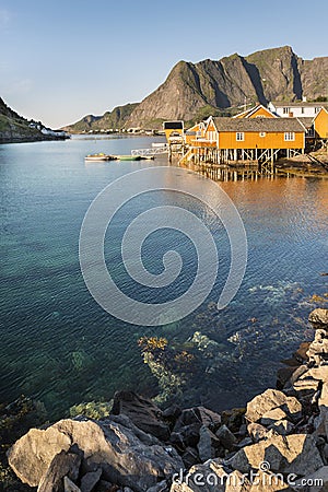 Orange wooden house called rorbu Stock Photo