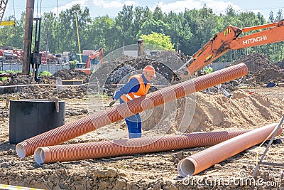 Worker at the construction site Editorial Stock Photo