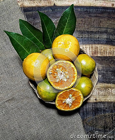 Orange is a yellow fruit containing vitamin C which is very hight Stock Photo