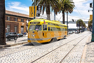The orange yellow tram in San Francisco Editorial Stock Photo