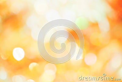 Orange, yellow and white bokeh light. Abstract or blurred of light glitter. Glow texture background. Stock Photo