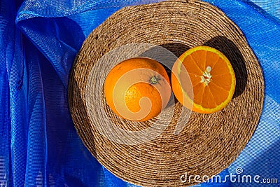 Oranges on a blue background top view Stock Photo